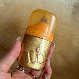 Urban decay face bond luminizer liquid highlight glow drops over the top *